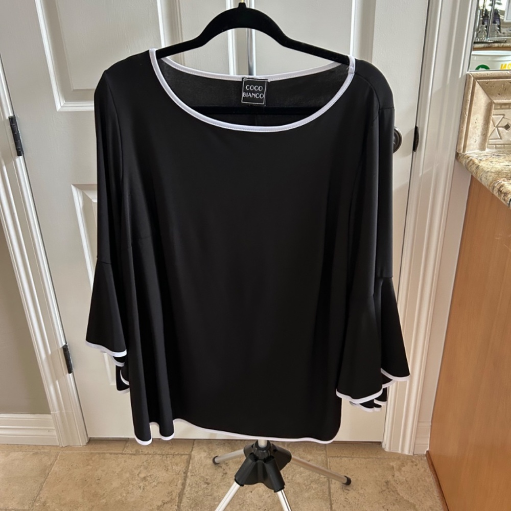 Coco Bianco Black and white top with bell sleeves.